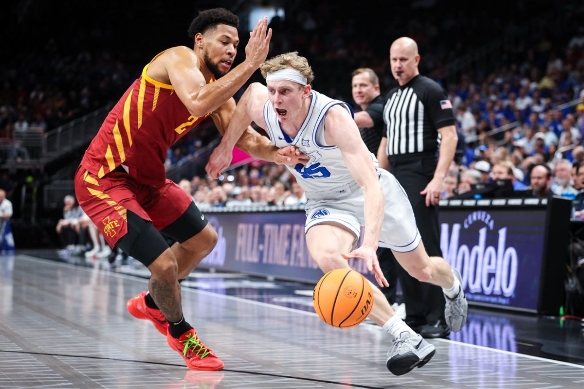 Mar 13, 2025; Kansas City, MO, USA; Brigham Young Cougars forward Richie Saunders (15) drives to the basket around Iowa State Cyclones forward Joshua Jefferson (2) during the first half at T-Mobile Center. Mandatory Credit: William Purnell-Imagn Images