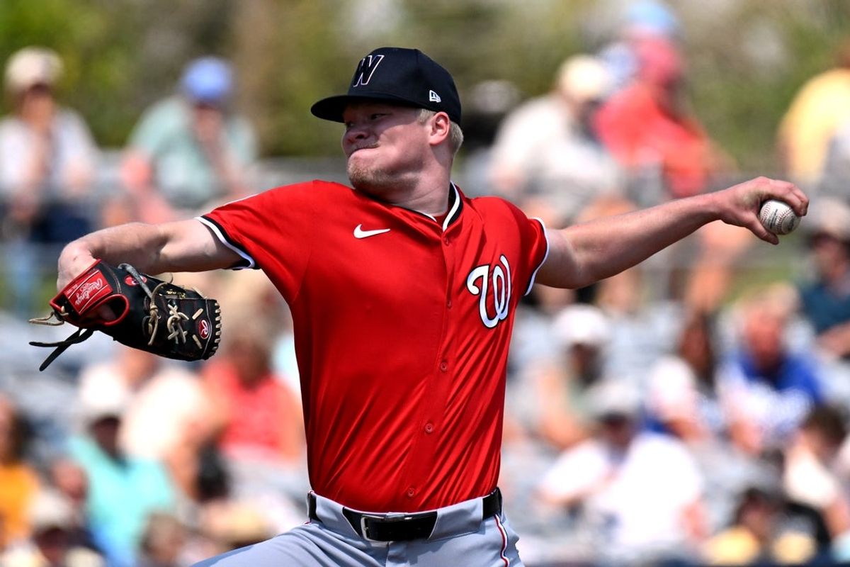 Mar 13, 2025; Port Charlotte, Florida, USA;  Washington Nationals starting pitcher Dj Herz (77) throws a pitch in the first inning against the Tampa Bays Rays during spring training at Charlotte Sports Park. Mandatory Credit: Jonathan Dyer-Imagn Images
