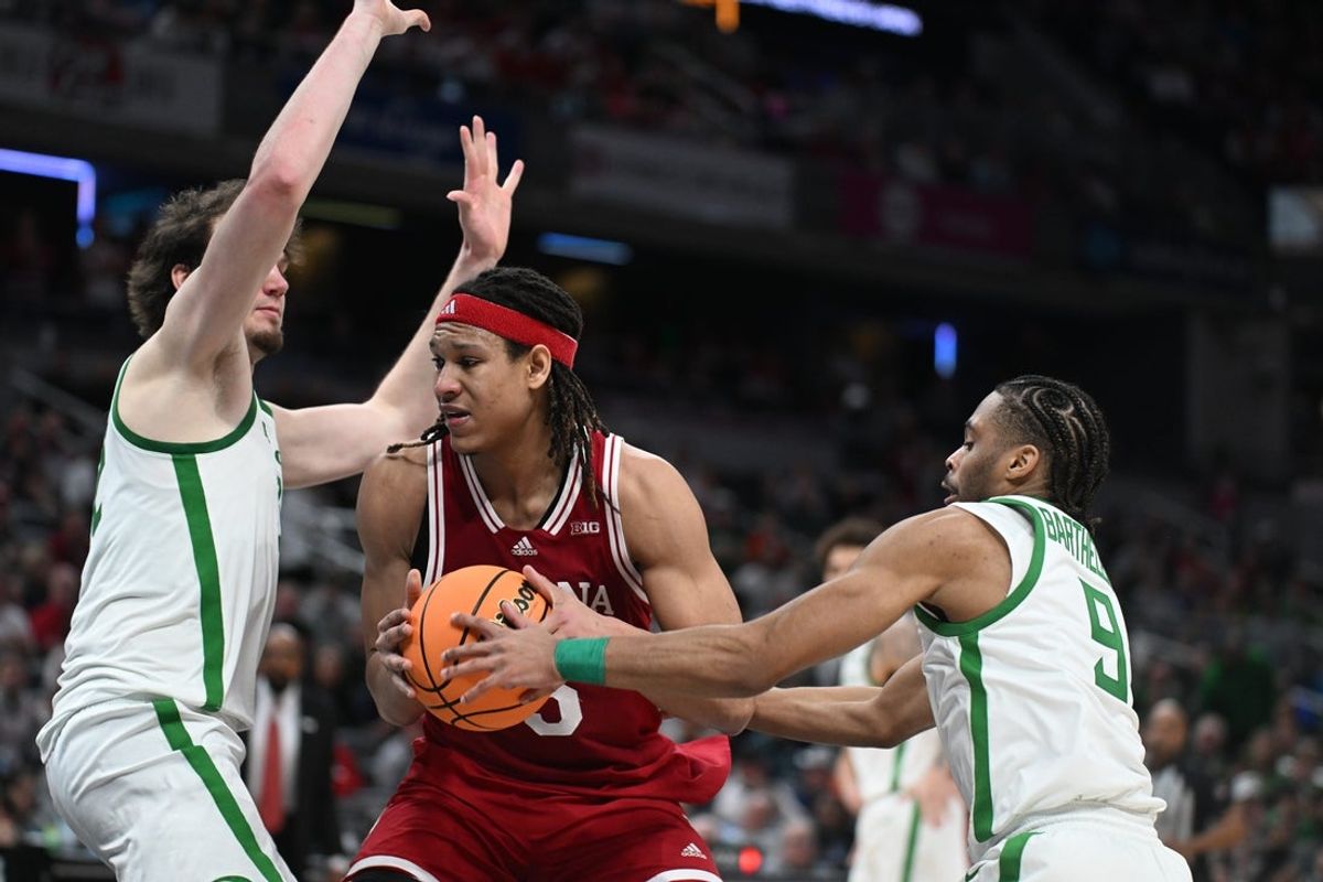Mar 13, 2025; Indianapolis, IN, USA; Oregon Ducks guard Keeshawn Barthelemy (9) knocks the ball away from Indiana Hoosiers forward Malik Reneau (5) during the second half at Gainbridge Fieldhouse. Mandatory Credit: Robert Goddin-Imagn Images