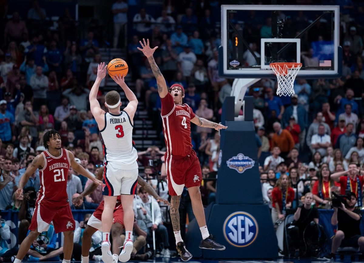 Mississippi Rebels guard Sean Pedulla (3) shoots over Arkansas Razorbacks forward Trevon Brazile (4) for the game-winning shot during their second round game of the SEC Men's Basketball Tournament at Bridgestone Arena in Nashville, Tenn., Thursday, March 13, 2025. The Rebels advanced to the third round with the 83-80 win.