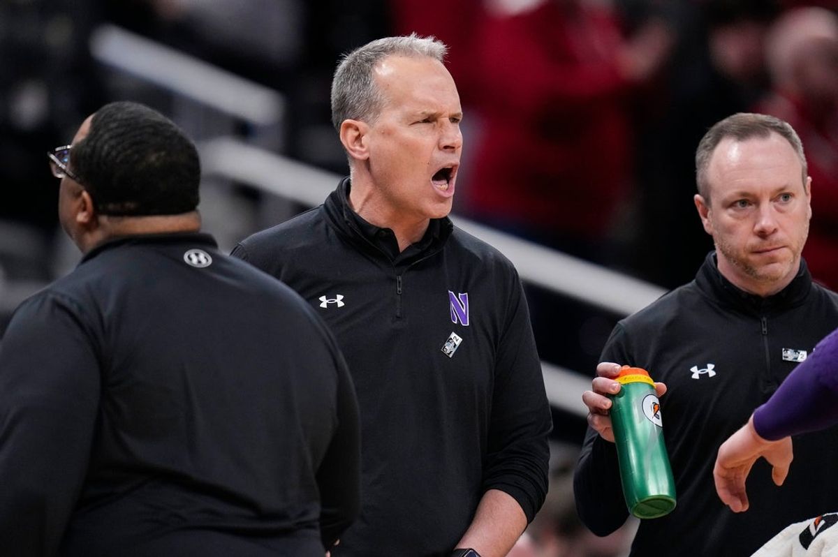 Northwestern Wildcats head coach Chris Collins yells to players on the court Thursday, March 13, 2025, during the second round of the men's Big Ten tournament at Gainbridge Fieldhouse in Indianapolis. The Wisconsin Badgers defeated the Northwestern Wildcats, 70-63.