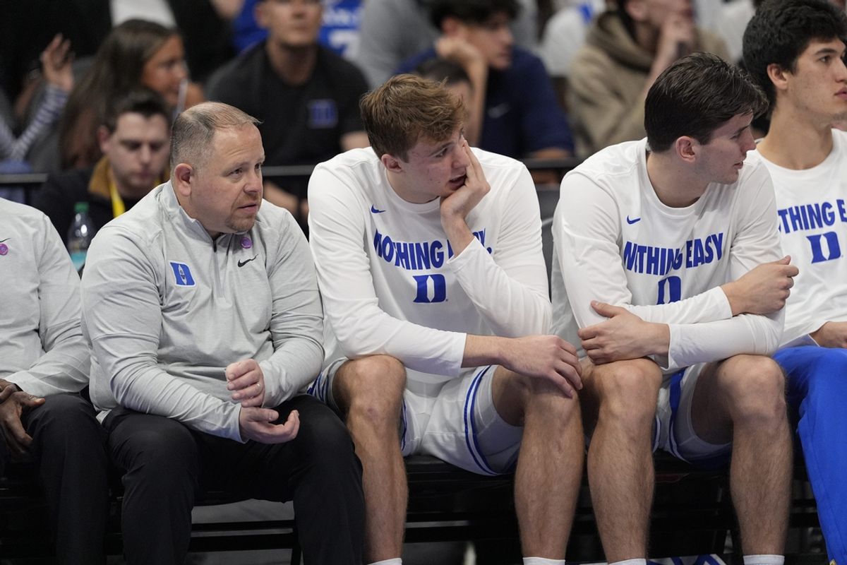 Mar 13, 2025; Charlotte, NC, USA; Duke Blue Devils forward Cooper Flagg (2) sits injured on the bench during the second half against the Georgia Tech Yellow Jackets at Spectrum Center. Mandatory Credit: Jim Dedmon-Imagn Images