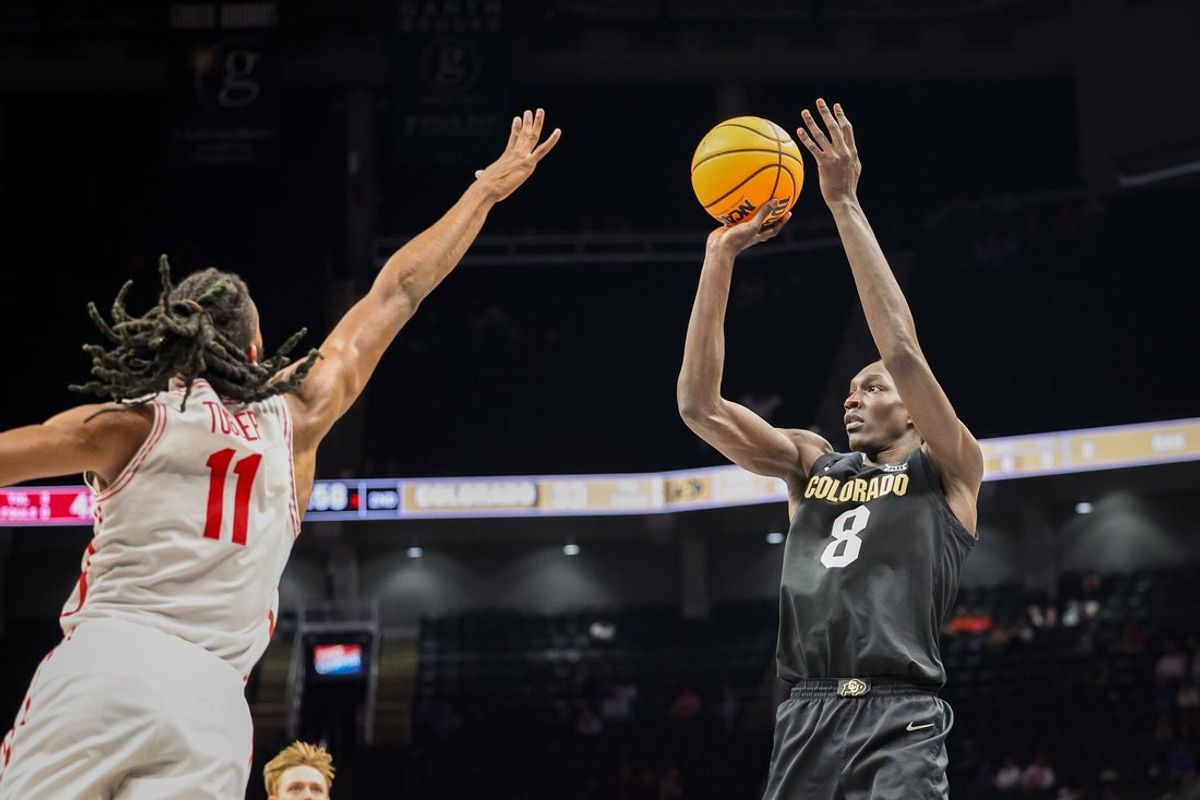 Mar 13, 2025; Kansas City, MO, USA; Colorado Buffaloes forward Bangot Dak (8) shoots the ball over Houston Cougars forward Joseph Tugler (11) during the second half at T-Mobile Center. Mandatory Credit: William Purnell-Imagn Images