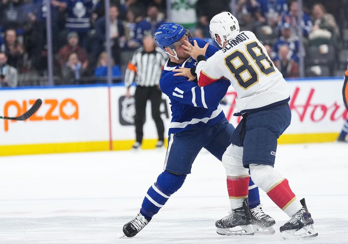 Mar 13, 2025; Toronto, Ontario, CAN; Toronto Maple Leafs center Max Domi (11) fights with Florida Panthers defenseman Nate Schmidt (88) during the first period at Scotiabank Arena. Mandatory Credit: Nick Turchiaro-Imagn Images