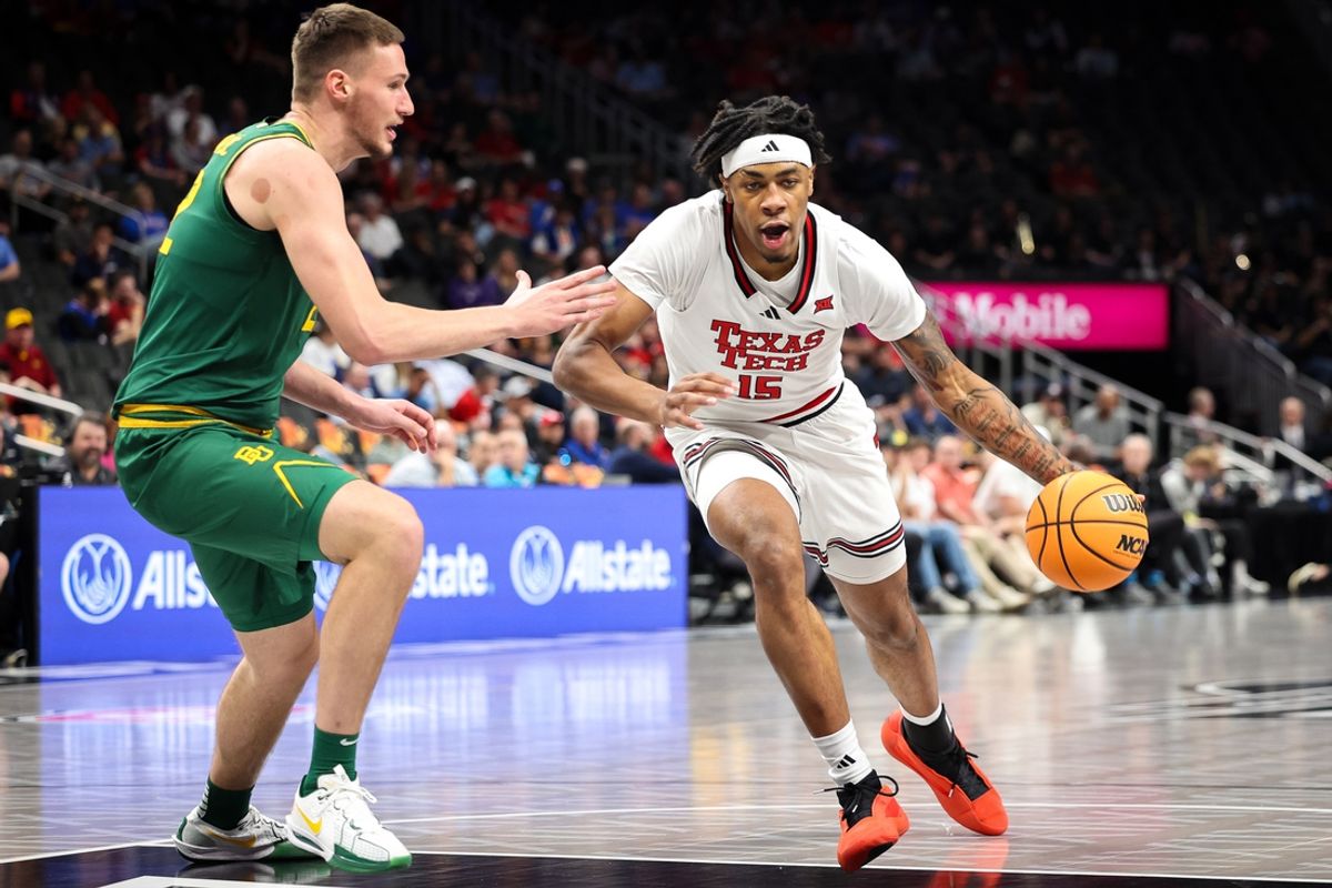 Mar 13, 2025; Kansas City, MO, USA; Texas Tech Red Raiders forward JT Toppin (15) drives to the basket around Baylor Bears forward Marino Dubravcic (22) during the first half at T-Mobile Center. Mandatory Credit: William Purnell-Imagn Images