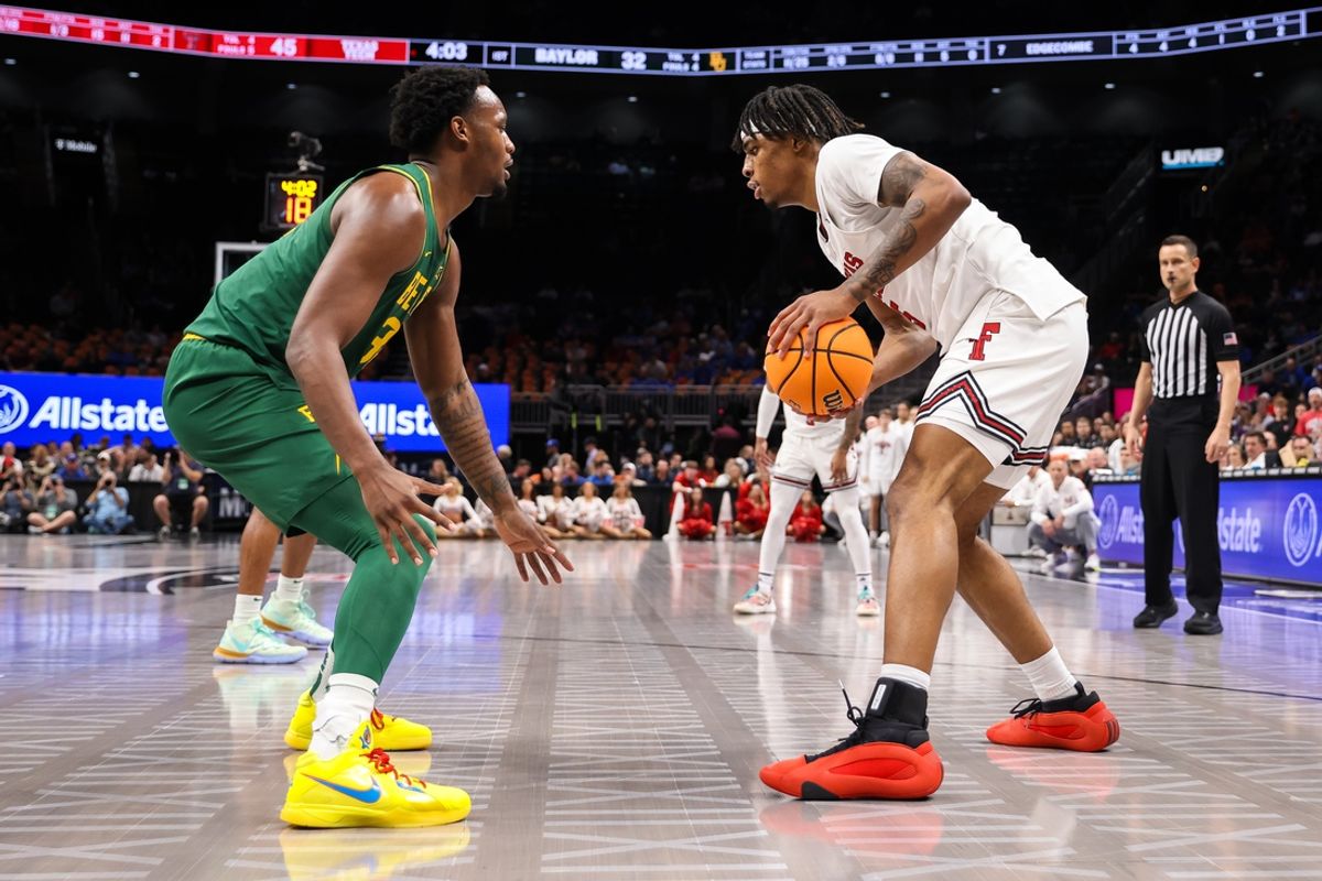 Mar 13, 2025; Kansas City, MO, USA; Texas Tech Red Raiders forward JT Toppin (15) and Baylor Bears guard Jalen Celestine (32) face off during the first half at T-Mobile Center. Mandatory Credit: William Purnell-Imagn Images