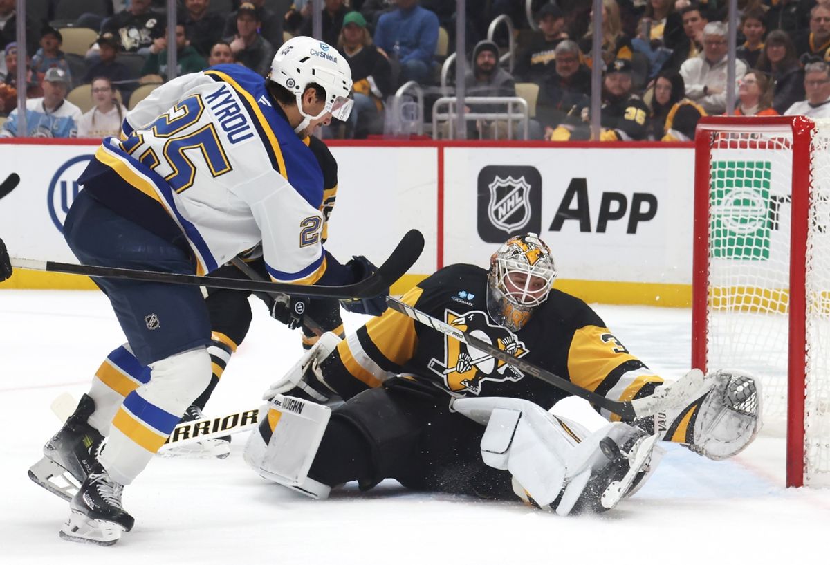 Mar 13, 2025; Pittsburgh, Pennsylvania, USA;  Pittsburgh Penguins goaltender Tristan Jarry (35) makes as save against St. Louis Blues center Jordan Kyrou (25) during the second period at PPG Paints Arena. Mandatory Credit: Charles LeClaire-Imagn Images