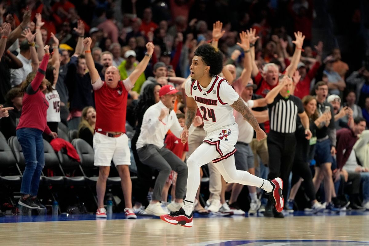 Mar 13, 2025; Charlotte, NC, USA; Louisville Cardinals guard Chucky Hepburn (24) reacts after hitting a last second shot to win the game at Spectrum Center. Mandatory Credit: Bob Donnan-Imagn Images