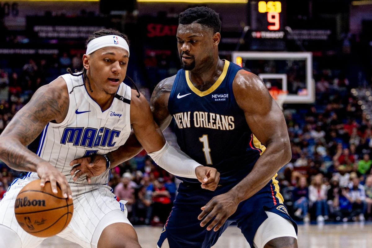 Mar 13, 2025; New Orleans, Louisiana, USA;  Orlando Magic forward Paolo Banchero (5) dribbles against New Orleans Pelicans forward Zion Williamson (1) during the first half at Smoothie King Center. Mandatory Credit: Stephen Lew-Imagn Images