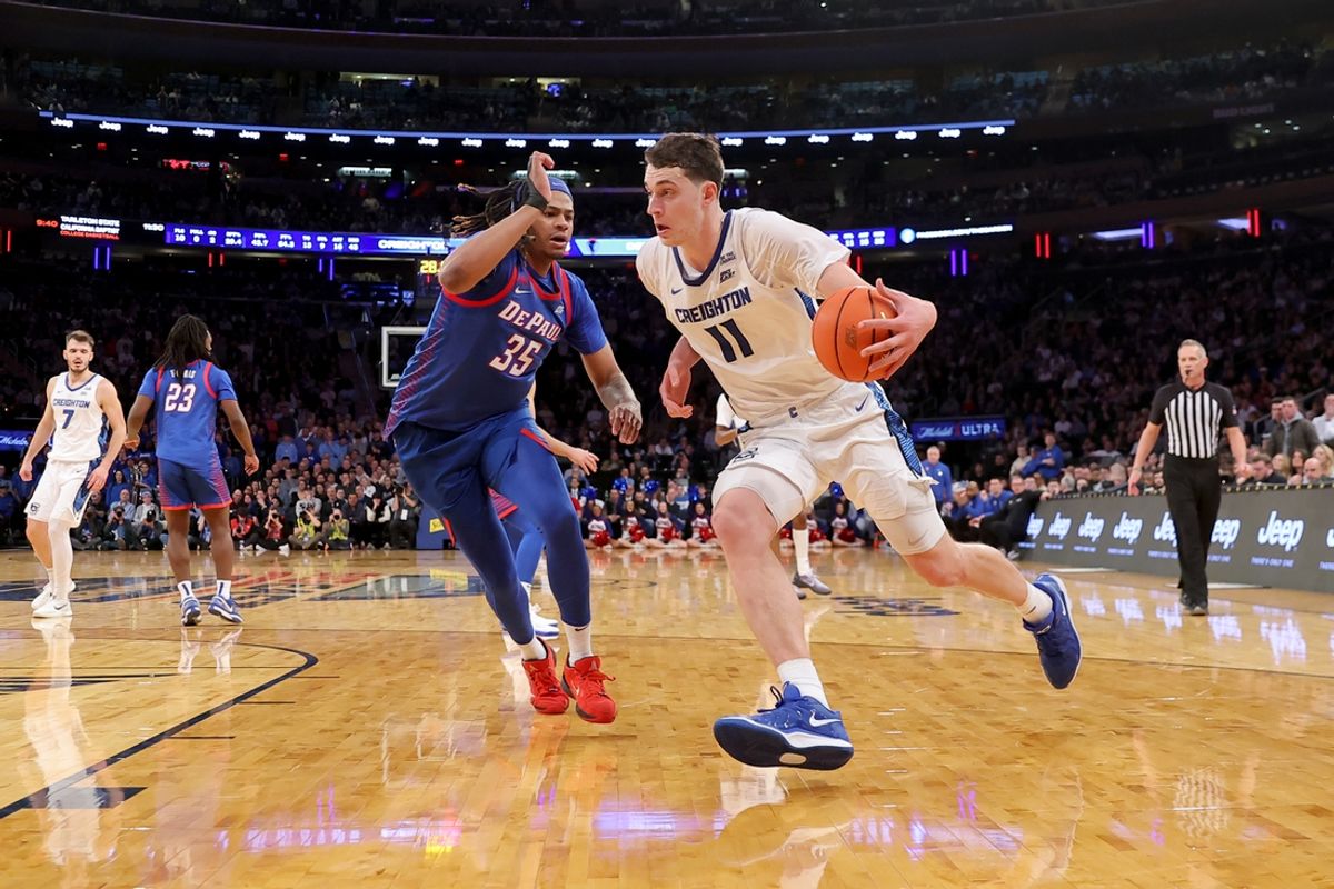 Mar 13, 2025; New York, NY, USA; Creighton Bluejays center Ryan Kalkbrenner (11) drives to the basket against DePaul Blue Demons forward NJ Benson (35) during the second overtime at Madison Square Garden. Mandatory Credit: Brad Penner-Imagn Images