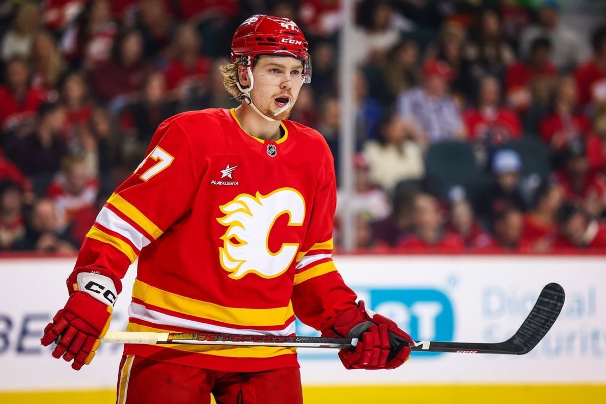 Mar 12, 2025; Calgary, Alberta, CAN; Calgary Flames center Connor Zary (47) skates against the Vancouver Canucks during the first period at Scotiabank Saddledome. Mandatory Credit: Sergei Belski-Imagn Images