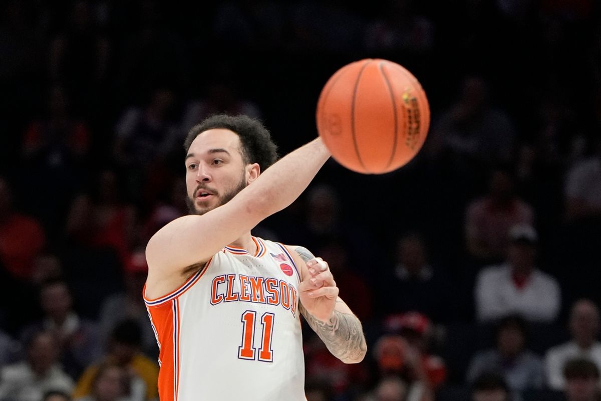 Clemson Tigers guard Jaeden Zackery (11) passes the ball in the first half at Spectrum Center.