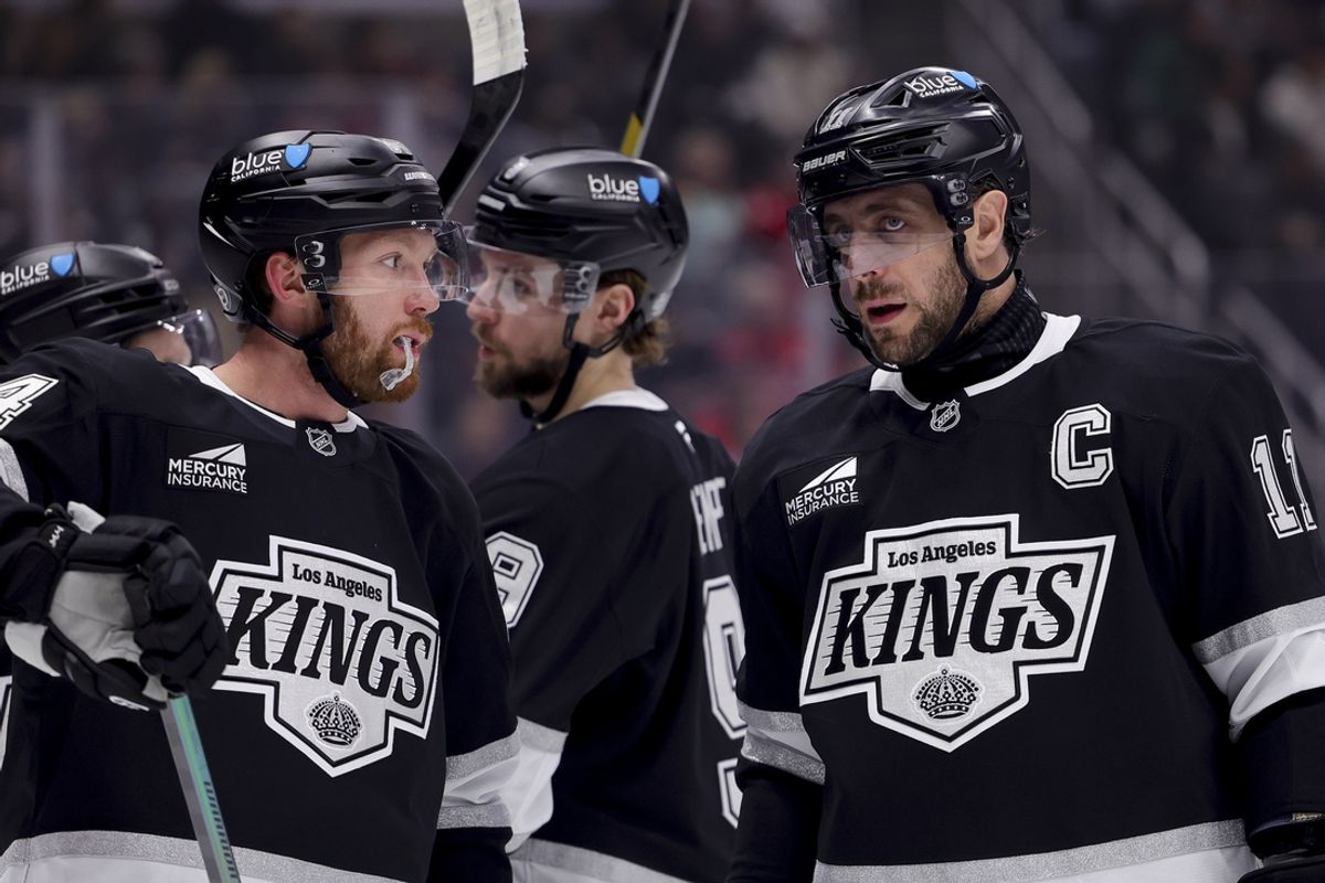 Mar 13, 2025; Los Angeles, California, USA; Los Angeles Kings center Anze Kopitar (11) speaks with defenseman Vladislav Gavrikov (84) during the first period of a game against the Washington Capitals at Crypto.com Arena. Mandatory Credit: Ryan Sun-Imagn Images