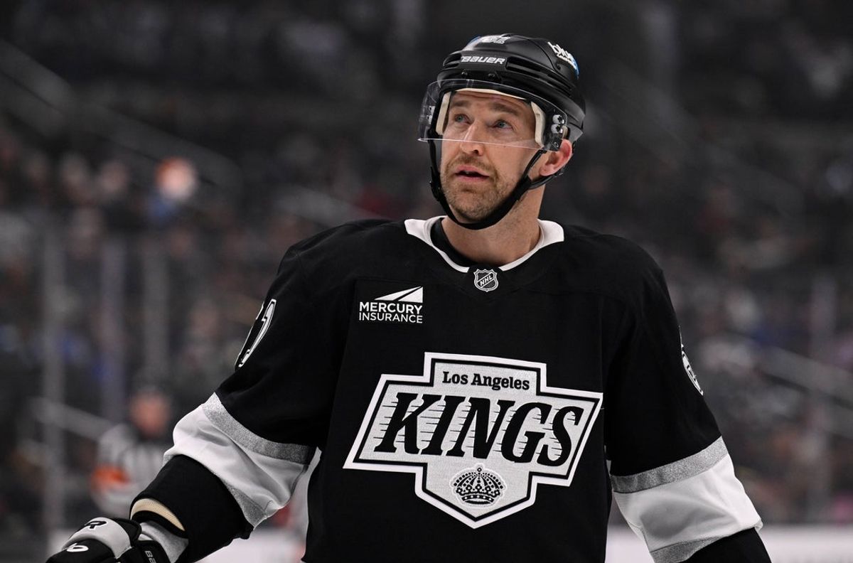 Mar 5, 2025; Los Angeles, California, USA;  Los Angeles Kings center Trevor Lewis (61) skates against the St. Louis Blues during the second period at Crypto.com Arena. Mandatory Credit: Alex Gallardo-Imagn Images