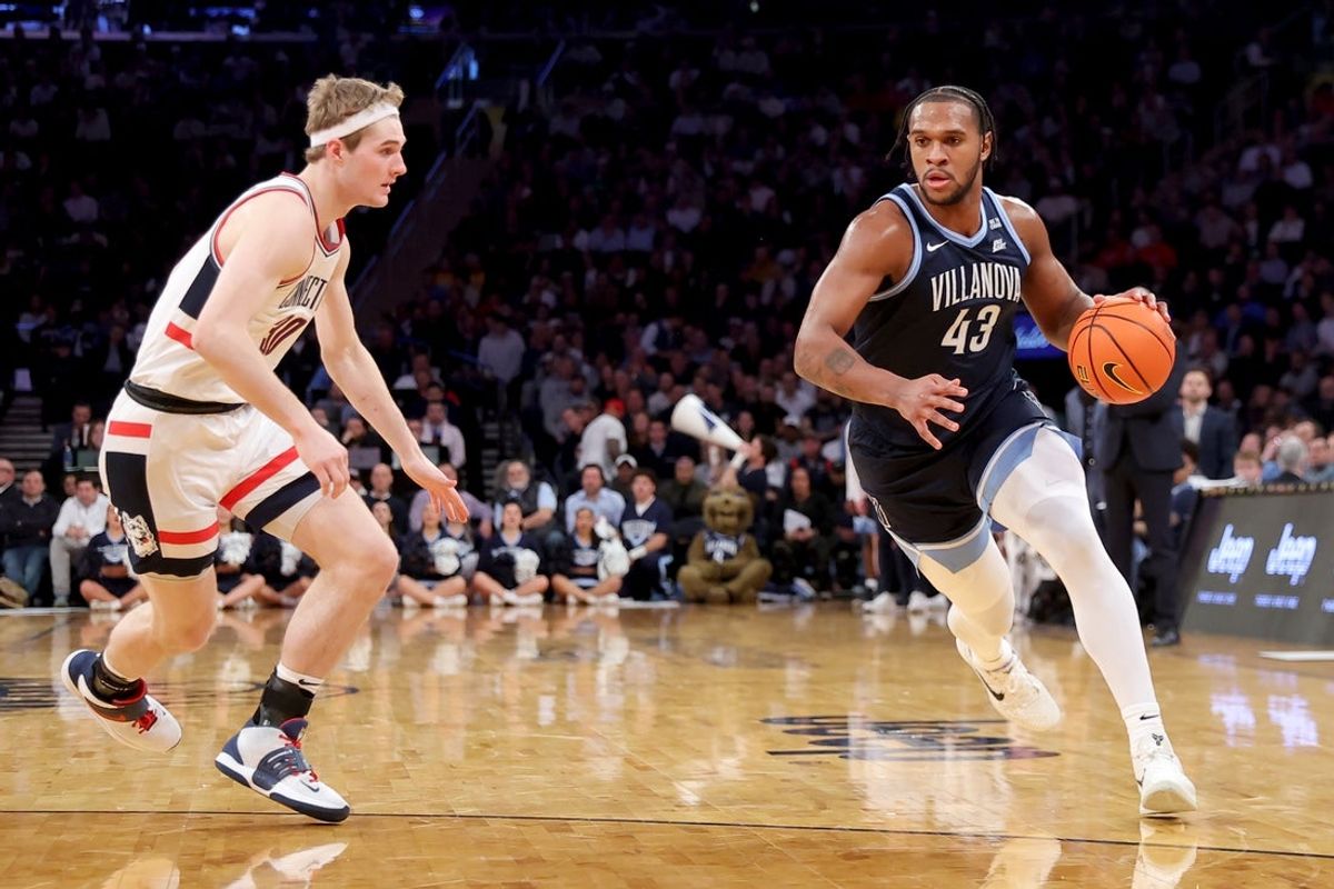 Mar 13, 2025; New York, NY, USA; Villanova Wildcats forward Eric Dixon (43) drives to the basket against Connecticut Huskies forward Liam McNeeley (30) during the first half at Madison Square Garden. Mandatory Credit: Brad Penner-Imagn Images
