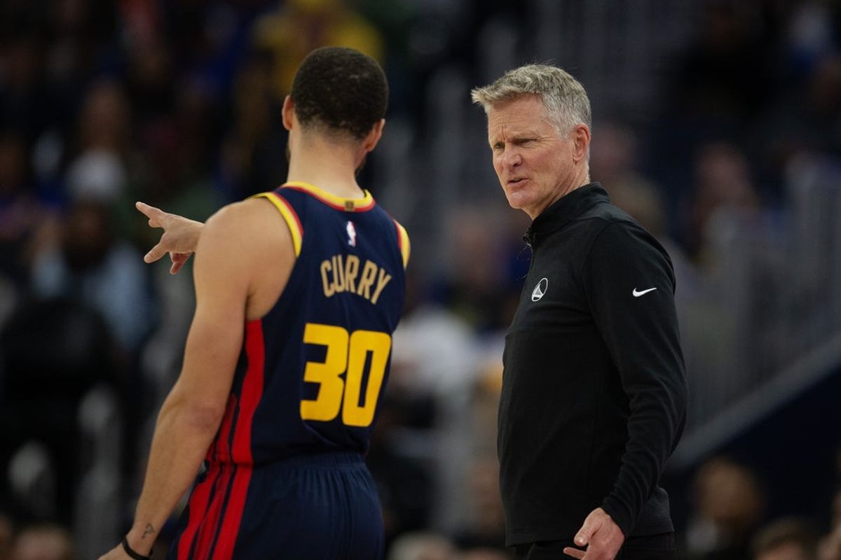 Mar 13, 2025; San Francisco, California, USA; Golden State Warriors head coach Steve Kerr confers with guard Stephen Curry (30)  during the second quarter against the Sacramento Kings at Chase Center. Mandatory Credit: D. Ross Cameron-Imagn Images
