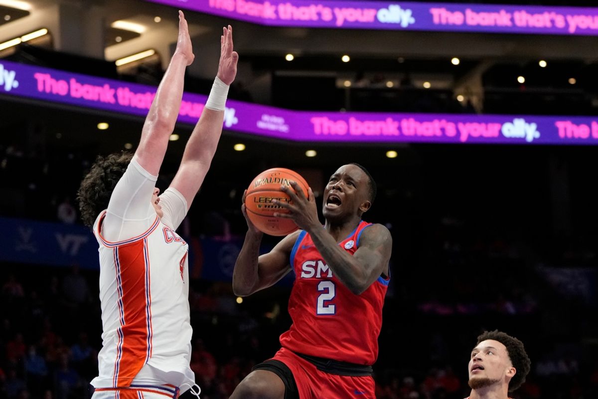 Mar 13, 2025; Charlotte, NC, USA; Southern Methodist Mustangs guard Boopie Miller (2) shoots as Clemson Tigers forward Ian Schieffelin (4) defends in the second half at Spectrum Center. Mandatory Credit: Bob Donnan-Imagn Images