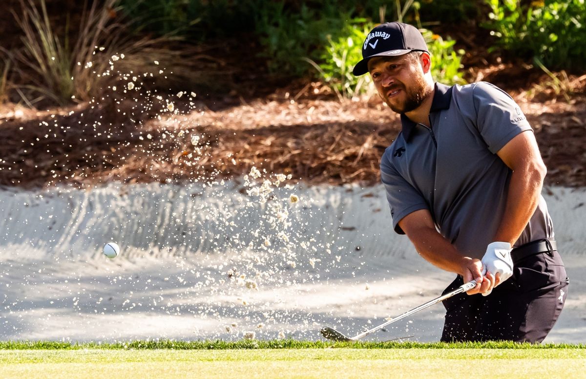Xander Schauffele blasts out of a bunker on the 13th holen during the second round of the Players Championship at TPC Sawgrass in Ponte Vedra Beach, Fl. Friday March 14, 2025. [Doug Engle/Florida Times-Union]