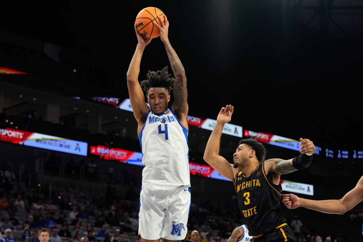 Mar 14, 2025; Fort Worth, TX, USA; Memphis Tigers guard PJ Haggerty (4) grabs a rebound against Wichita State Shockers forward Ronnie DeGray III (3) during the first half at Dickies Arena. Mandatory Credit: Chris Jones-Imagn Images
