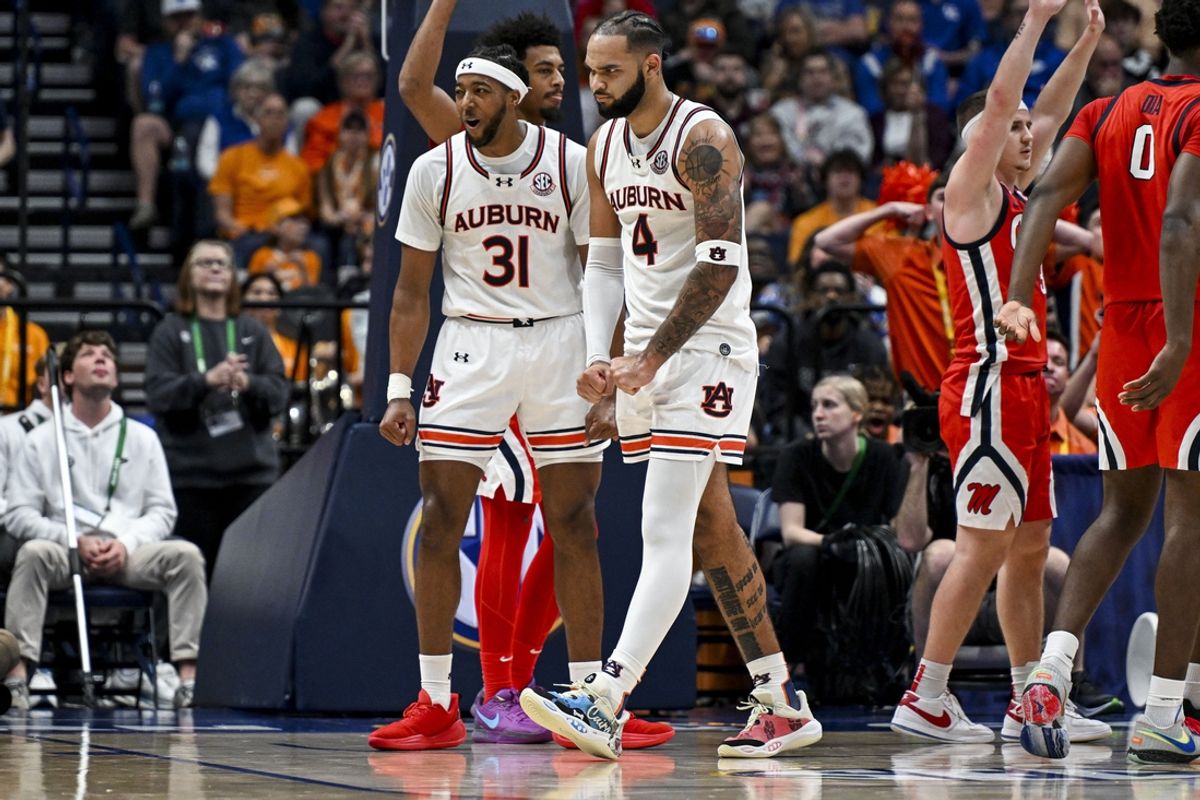 Mar 14, 2025; Nashville, TN, USA;  Auburn Tigers forward Johni Broome (4) celebrates the basket plus the foul against the Mississippi Rebels during the second half at Bridgestone Arena. Mandatory Credit: Steve Roberts-Imagn Images