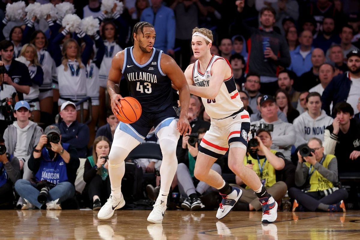 Mar 13, 2025; New York, NY, USA; Villanova Wildcats forward Eric Dixon (43) controls the ball against Connecticut Huskies forward Liam McNeeley (30) during the second half at Madison Square Garden. Mandatory Credit: Brad Penner-Imagn Images