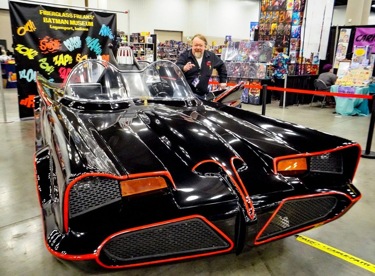 Reproduction Batmobile builder Steve Snider of Fiberglass Freaks Batman Museum in Logansport, Indiana, poses with one of the new fiberglass Batmobiles at Indiana Comic Con 2025 on Friday, March 14, 2025, at the Indiana Convention Center in Indianapolis.