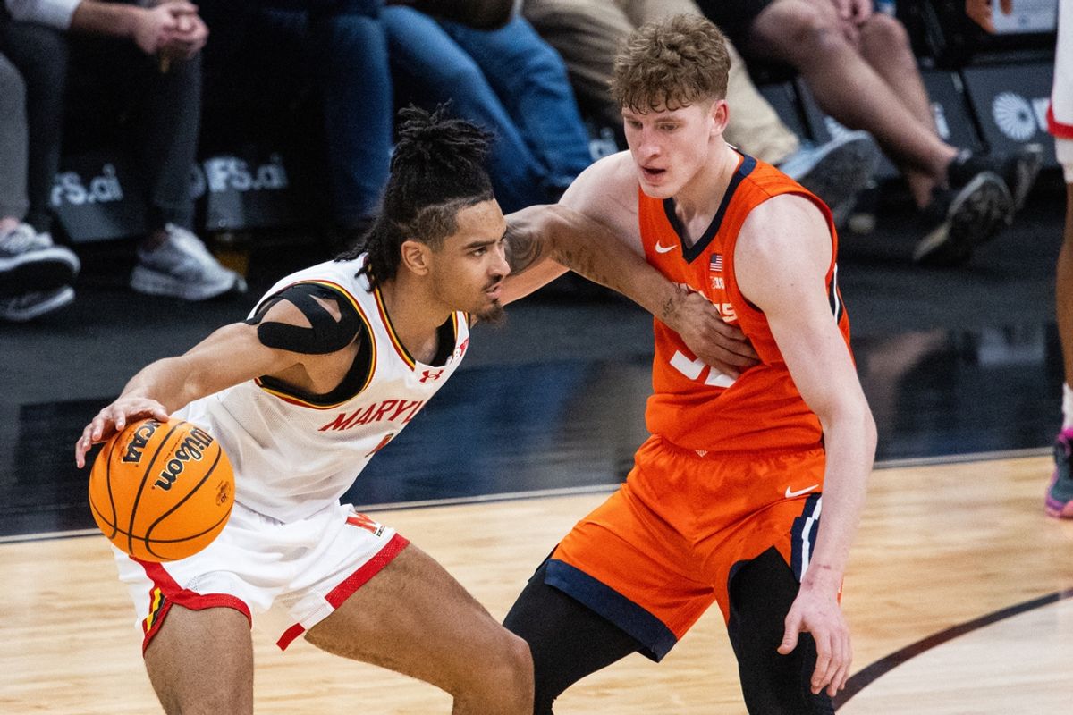 Mar 14, 2025; Indianapolis, IN, USA; Maryland Terrapins guard Rodney Rice (1) dribbles the ball while Illinois Fighting Illini guard Kasparas Jakucionis (32) defends in the first half  at Gainbridge Fieldhouse. Mandatory Credit: Trevor Ruszkowski-Imagn Images