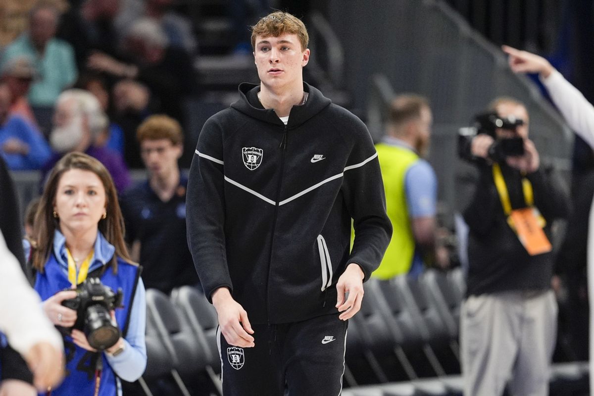 Mar 14, 2025; Charlotte, NC, USA; Duke Blue Devils forward Cooper Flagg (2) walks to the bench during the first half against the North Carolina Tar Heels at Spectrum Center. Mandatory Credit: Jim Dedmon-Imagn Images