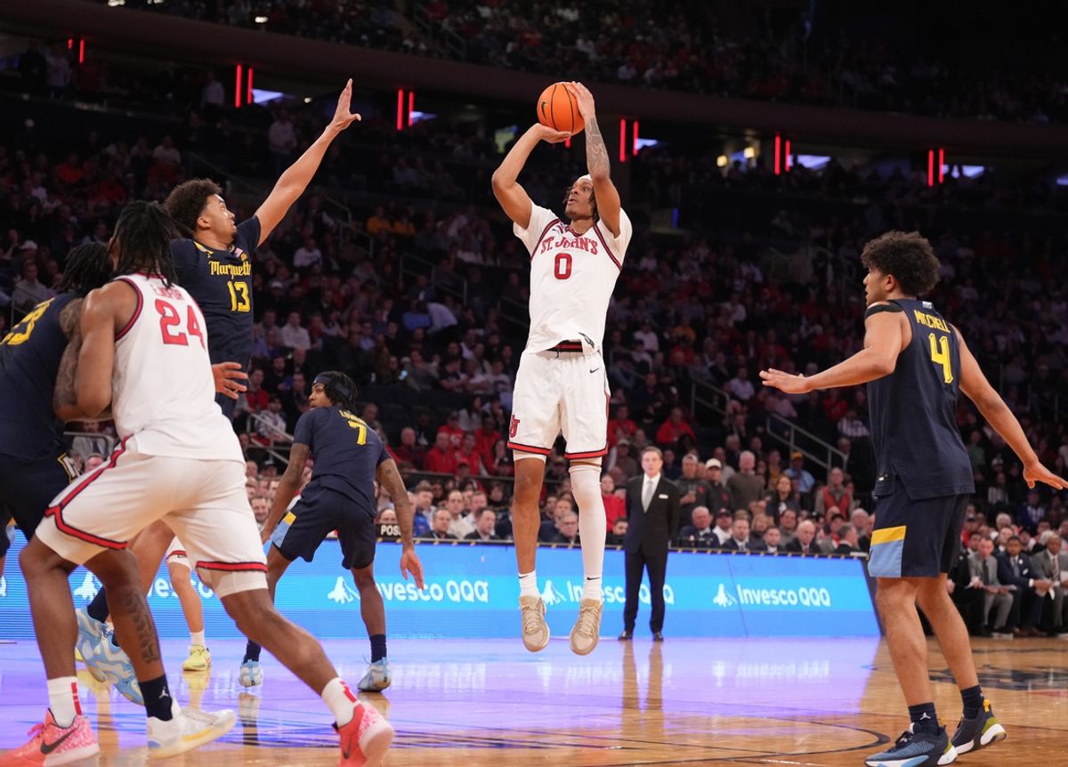 Mar 14, 2025; New York, NY, USA;  St. John's Red Storm guard Aaron Scott (0) shoots against Marquette Golden Eagles in the first half at Madison Square Garden. Mandatory Credit: Robert Deutsch-Imagn Images