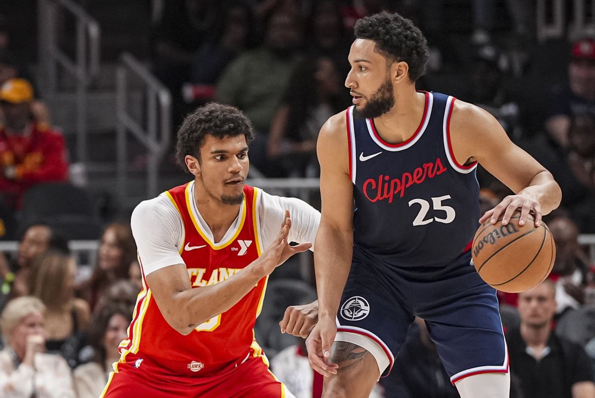 Mar 14, 2025; Atlanta, Georgia, USA; LA Clippers guard Ben Simmons (25) dribbles defended by Atlanta Hawks forward Dominick Barlow (0) during the first half at State Farm Arena. Mandatory Credit: Dale Zanine-Imagn Images