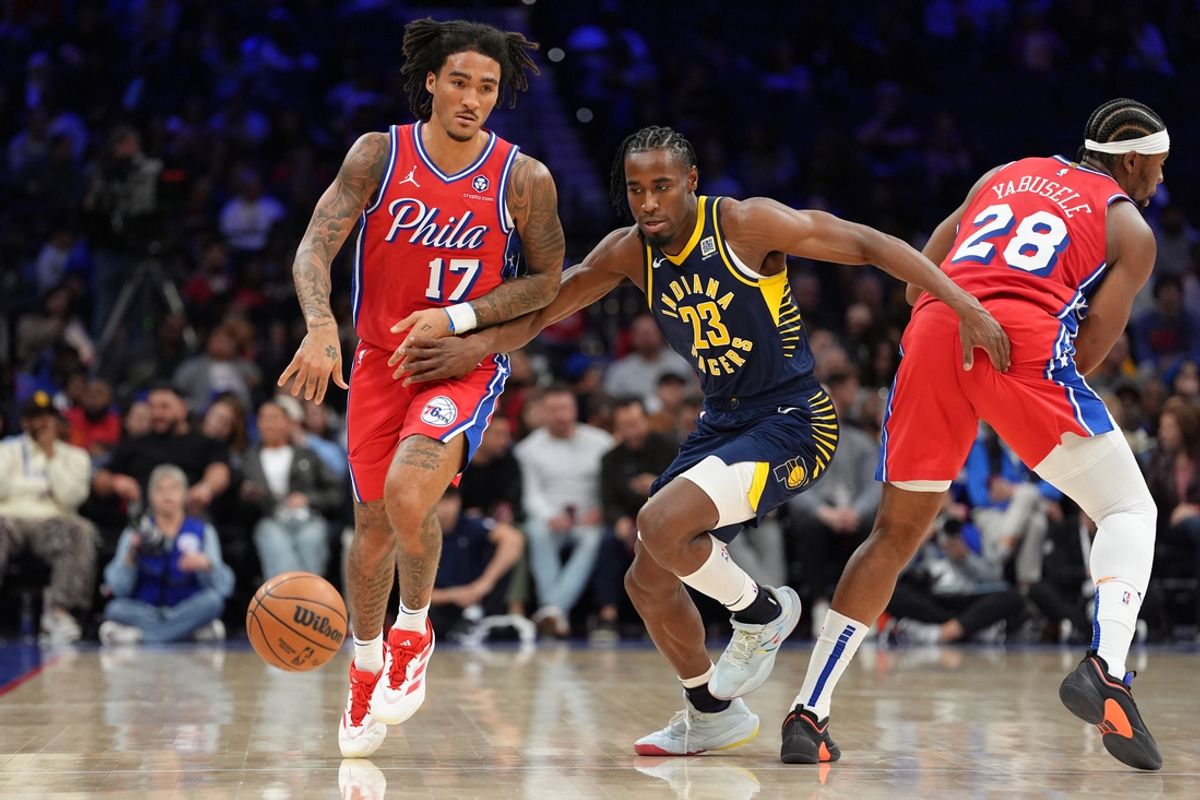 Mar 14, 2025; Philadelphia, Pennsylvania, USA; Philadelphia 76ers guard Jalen-Hood Schifino (17) drives against Indiana Pacers guard Aaron Nesmith (23) in the second quarter at Wells Fargo Center. Mandatory Credit: Kyle Ross-Imagn Images