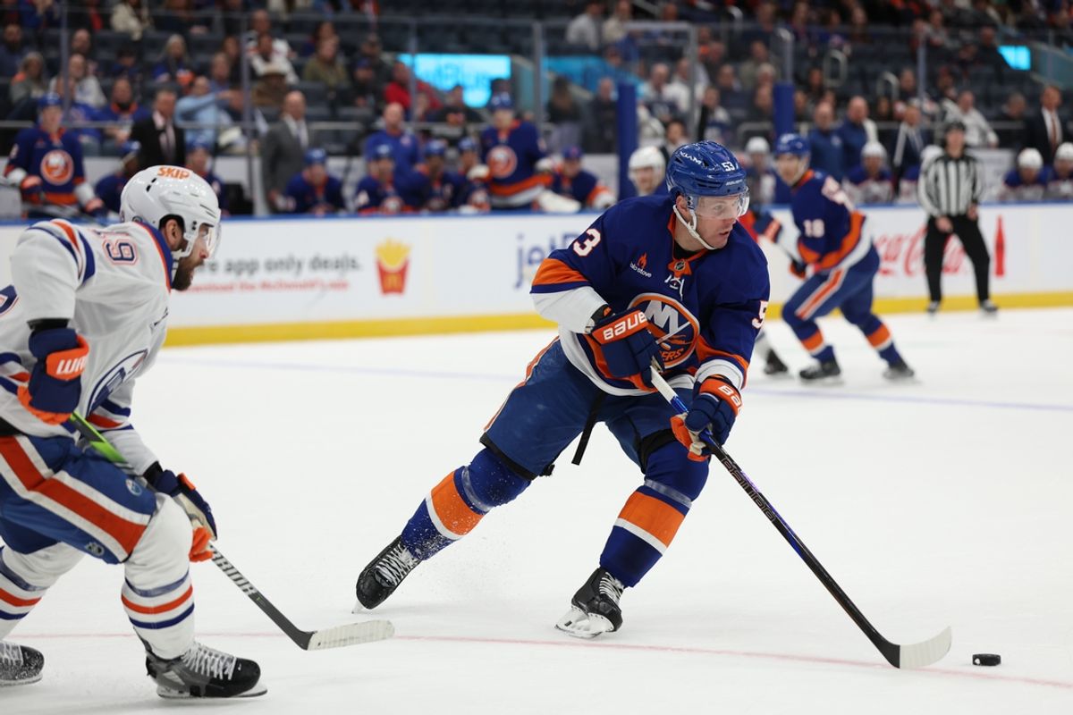 Mar 14, 2025; Elmont, New York, USA; New York Islanders center Casey Cizikas (53) skates with the puck against the Edmonton Oilers during the first period at UBS Arena. Mandatory Credit: Thomas Salus-Imagn Images