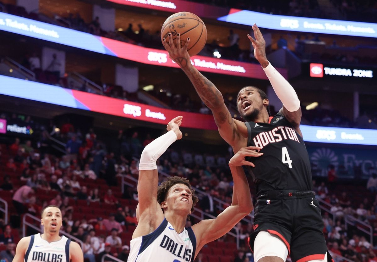 Mar 14, 2025; Houston, Texas, USA; Houston Rockets guard Jalen Green (4) shoots against Dallas Mavericks forward Kessler Edwards (20) in the first half at Toyota Center. Mandatory Credit: Thomas Shea-Imagn Images