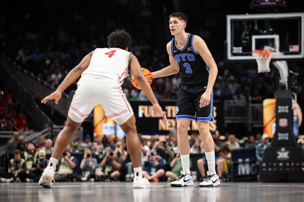 Mar 14, 2025; Kansas City, MO, USA; Brigham Young Cougars guard Egor Demin (3) dribbles against Houston Cougars guard L.J. Cryer (4) during the second half at T-Mobile Center. Mandatory Credit: William Purnell-Imagn Images