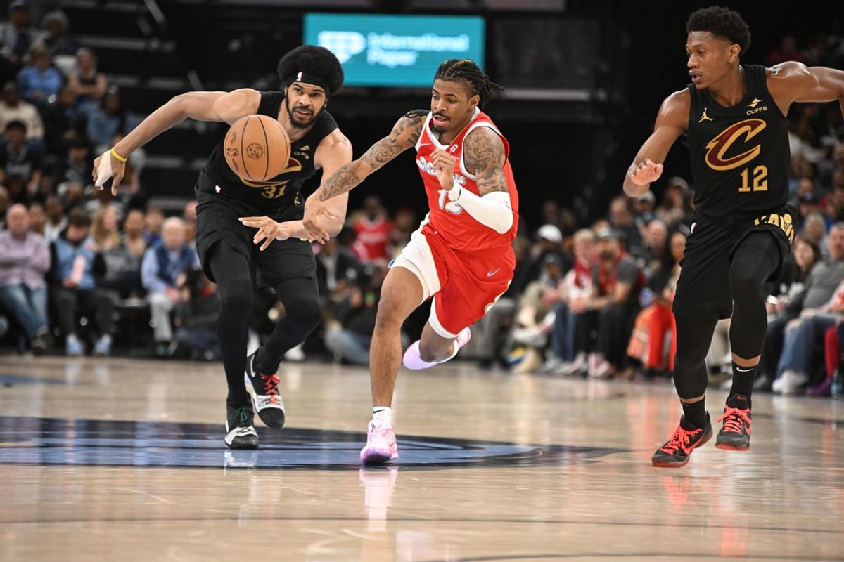 Mar 14, 2025; Memphis, Tennessee, USA; Cleveland Cavaliers center Jarrett Allen (31) pokes away the ball from Memphis Grizzlies point guard Ja Morant (12) in the 2nd quarter of the Cleveland Cavaliers vs. Memphis Grizzlies game at FedExForum. Mandatory Credit: Matthew Smith-Imagn Images