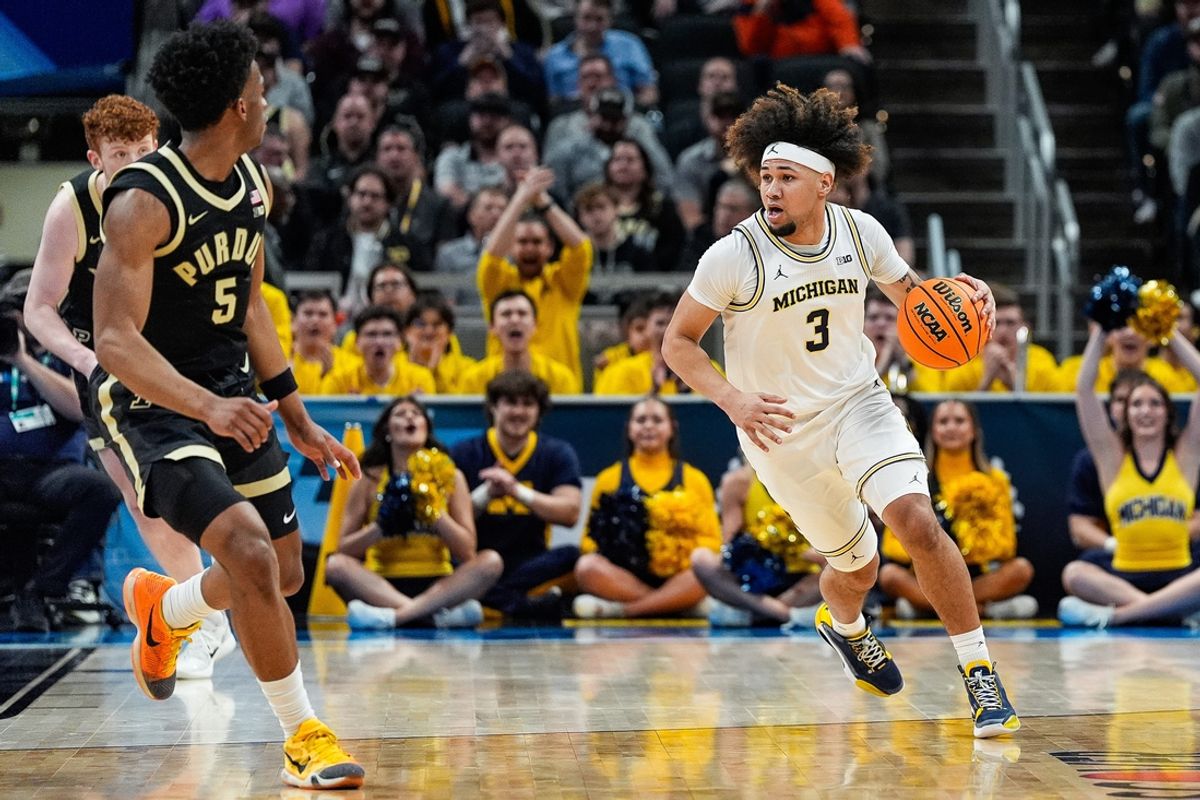 Michigan guard Tre Donaldson (3) dribbles against Purdue during the first half of Big Ten Tournament quarterfinal at Gainbridge Fieldhouse in Indianapolis, Ind. on Friday, March 14, 2025.
