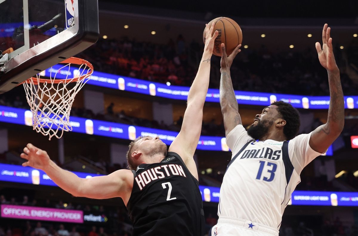 Mar 14, 2025; Houston, Texas, USA; Dallas Mavericks forward Naji Marshall (13) has his shot blocked by Houston Rockets center Jock Landale (2) in the second half at Toyota Center. Mandatory Credit: Thomas Shea-Imagn Images
