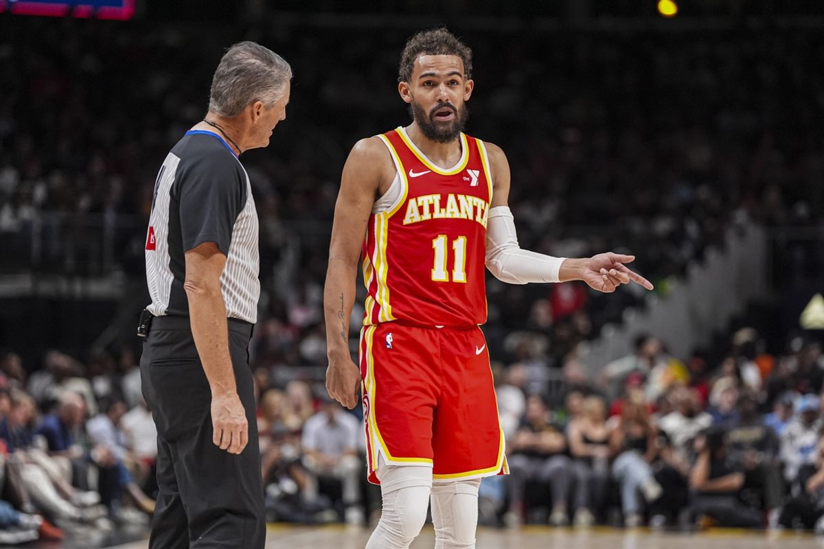 Mar 14, 2025; Atlanta, Georgia, USA; Atlanta Hawks guard Trae Young (11) reacts to official Scott Foster (48) during the game against the LA Clippers during the second half at State Farm Arena. Mandatory Credit: Dale Zanine-Imagn Images