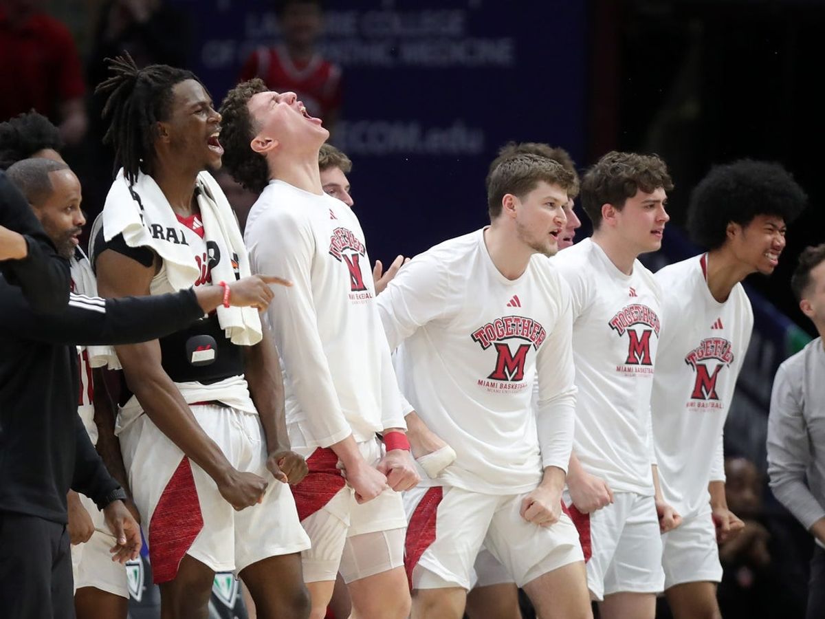 The Miami bench goes wild as the RedHawks take over during the second half of an NCAA college basketball game against the Kent State Golden Flashes in the semifinals of the Mid-American Conference Tournament at Rocket Arena on Friday, March 14, 2025, in Cleveland, Ohio.