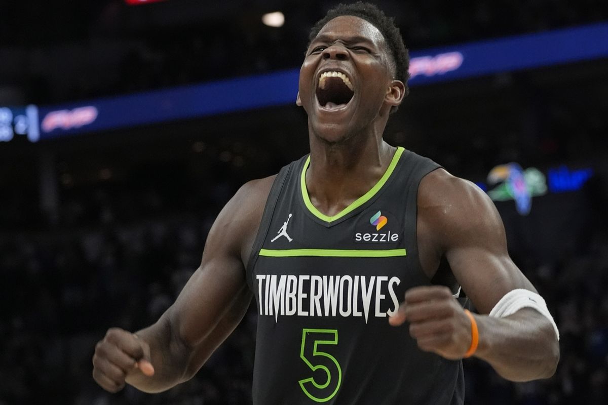 Mar 14, 2025; Minneapolis, Minnesota, USA; Minnesota Timberwolves guard Anthony Edwards (5) celebrates a series of plays that extended their lead over the Orlando Magic late in the fourth quarter at Target Center. Mandatory Credit: Bruce Kluckhohn-Imagn Images