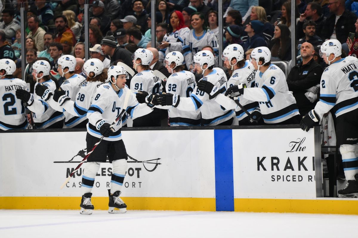 Mar 14, 2025; Seattle, Washington, USA; Utah Hockey Club center Nick Schmaltz (8) celebrates with the bench after scoring a goal against the Seattle Kraken during the first period at Climate Pledge Arena. Mandatory Credit: Steven Bisig-Imagn Images