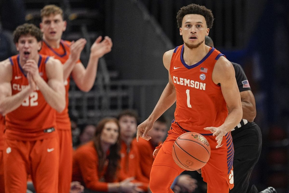 Mar 14, 2025; Charlotte, NC, USA; Clemson Tigers guard Chase Hunter (1) brings the ball up court against the Louisville Cardinals during the first half at Spectrum Center. Mandatory Credit: Jim Dedmon-Imagn Images