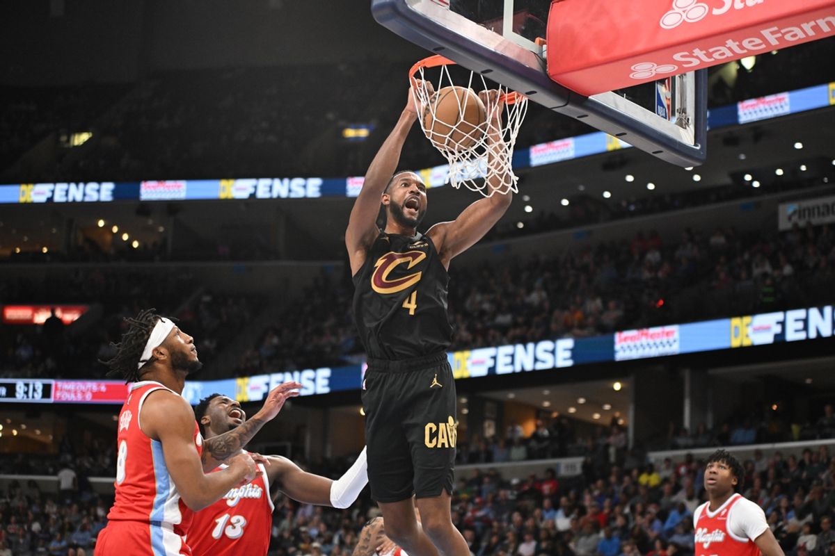 Mar 14, 2025; Memphis, Tennessee, USA;  Cleveland Cavaliers power forward Evan Mobley (4) dunks the ball in the 4th quarter of the Cleveland Cavaliers vs. Memphis Grizzlies game at FedExForum. Mandatory Credit: Matthew Smith-Imagn Images