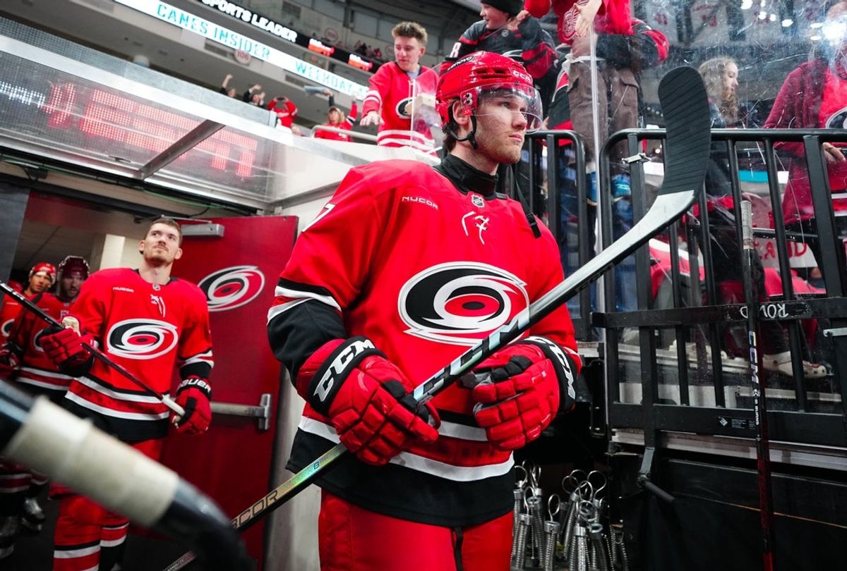 Mar 14, 2025; Raleigh, North Carolina, USA;  Carolina Hurricanes center Mark Jankowski (77) comes out of the locker room for the warmups before the game against the Detroit Red Wings at Lenovo Center. Mandatory Credit: James Guillory-Imagn Images