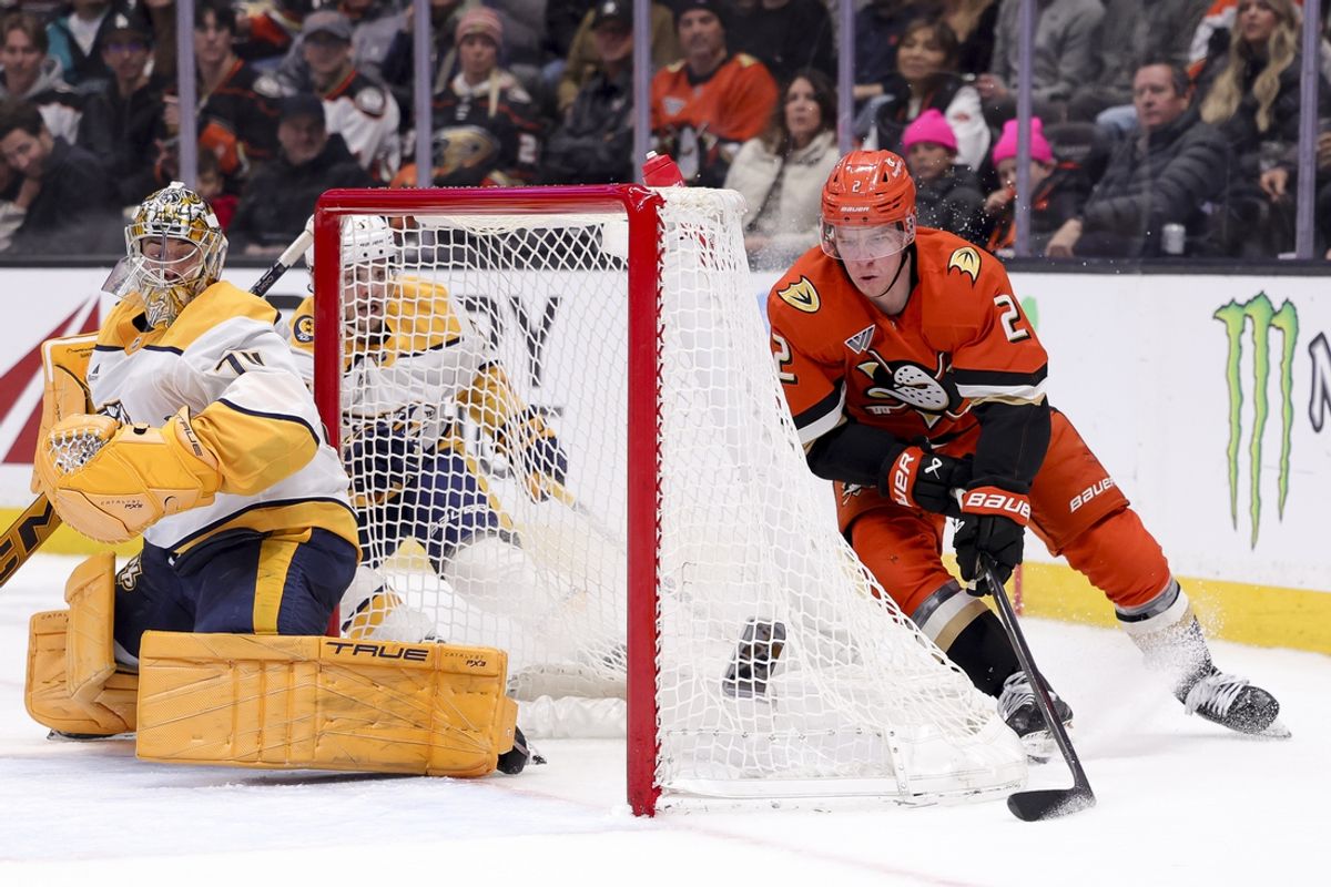 Mar 14, 2025; Anaheim, California, USA; Anaheim Ducks defenseman Jackson LaCombe (2) looks to shoot against Nashville Predators goaltender Juuse Saros (74) during the second period at Honda Center. Mandatory Credit: Ryan Sun-Imagn Images