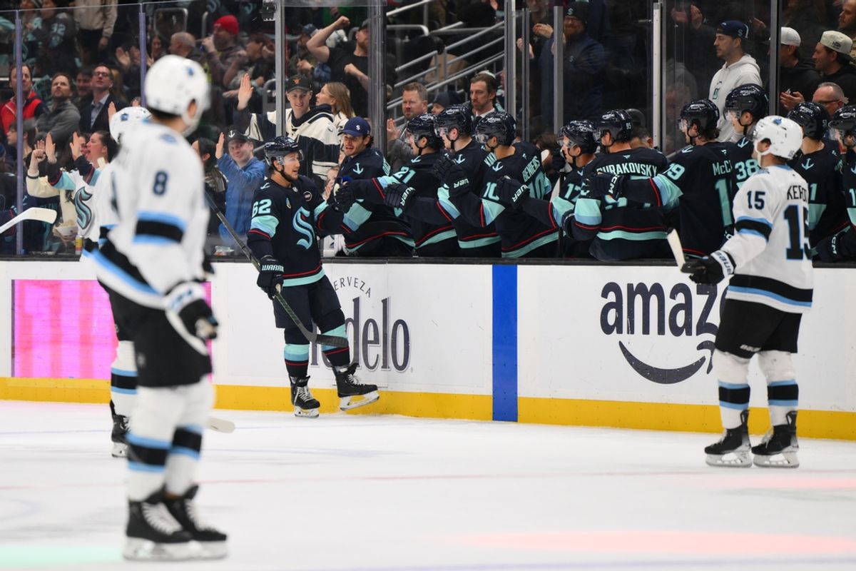 Mar 14, 2025; Seattle, Washington, USA; Seattle Kraken defenseman Brandon Montour (62) celebrates with the bench after scoring a goal against the Utah Hockey Club during the second period at Climate Pledge Arena. Mandatory Credit: Steven Bisig-Imagn Images