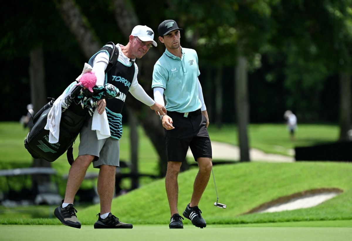 [US, Mexico, & Canada customers only] Mar 15, 2025; Singapore, SINGAPORE; Joaquin Niemann with his caddie during the first round of LIV Golf Singapore at Sentosa Golf Club. Mandatory Credit: Andy Chua/Reuters via Imagn Images
