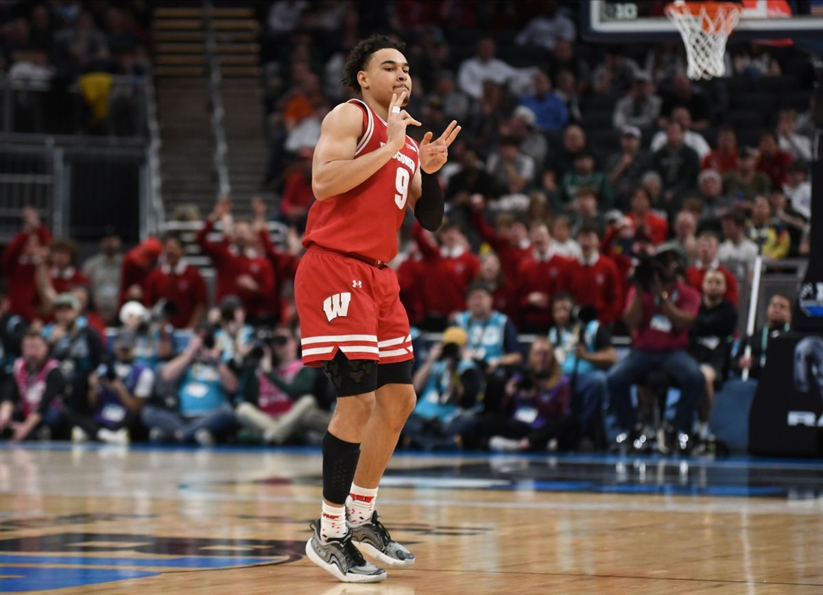 Mar 15, 2025; Indianapolis, IN, USA; Wisconsin Badgers guard John Tonje (9) celebrates after making a three-point basket during the first half against the Michigan State Spartans at Gainbridge Fieldhouse. Mandatory Credit: Robert Goddin-Imagn Images
