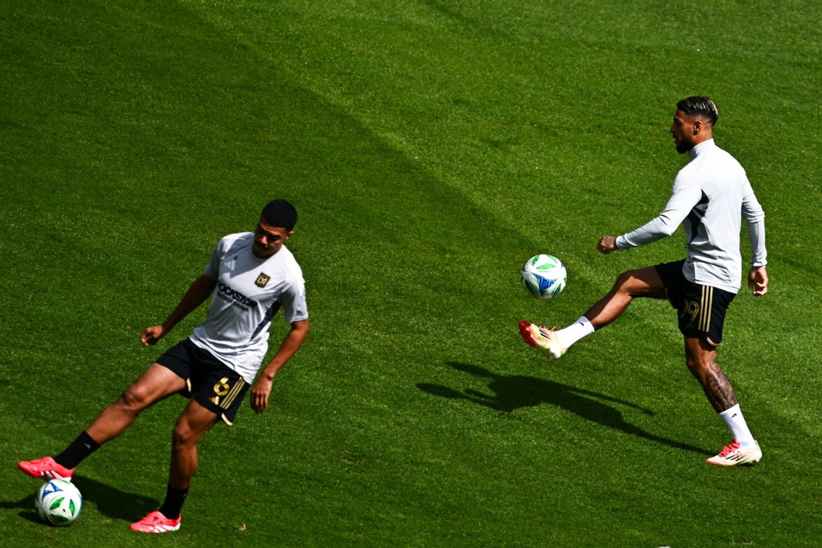 Mar 15, 2025; Los Angeles, California, USA; Los Angeles FC forward Denis Bouanga (99) warms up next to midfielder Igor Jesus  (6)  before the game against Austin FC at BMO Stadium. Mandatory Credit: Kelvin Kuo-Imagn Images