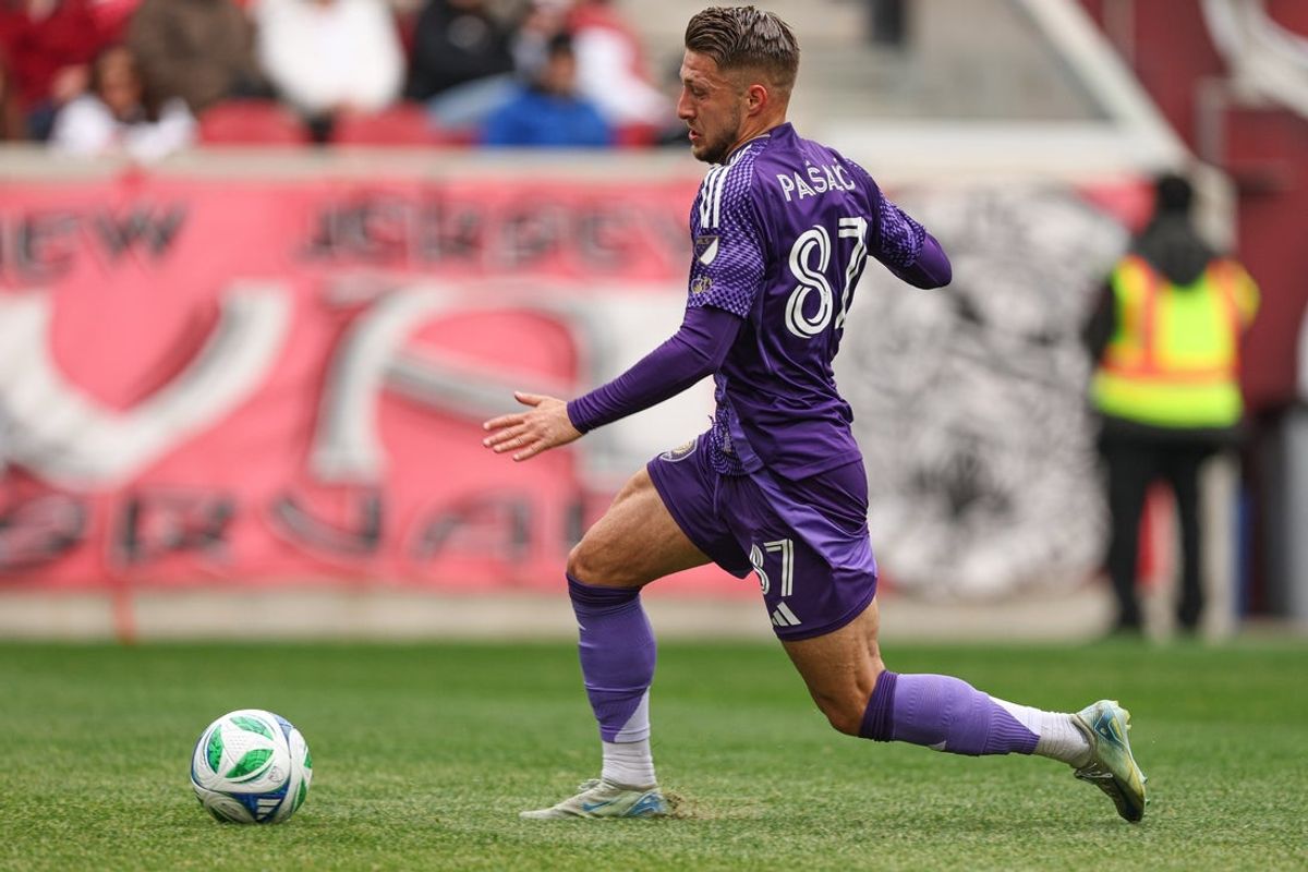 Mar 15, 2025; Harrison, New Jersey, USA; Orlando City forward Marco Pasalic (87) plays the ball against the New York Red Bulls during the first half at Sports Illustrated Stadium. Mandatory Credit: Vincent Carchietta-Imagn Images